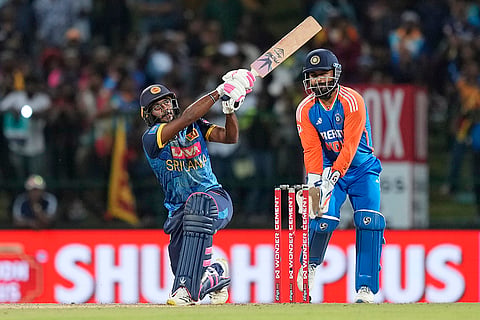 Ramesh Mendis hits a six against India